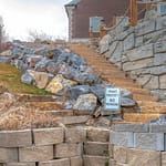 stone path with cantilever wall in back yard