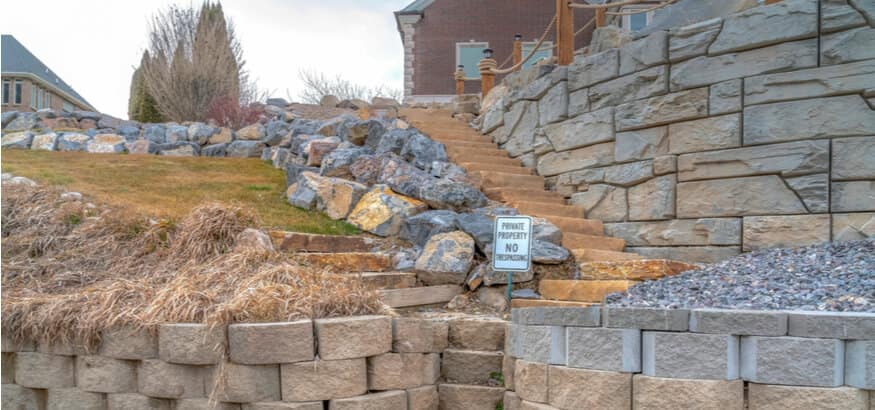 stone path with cantilever wall in back yard